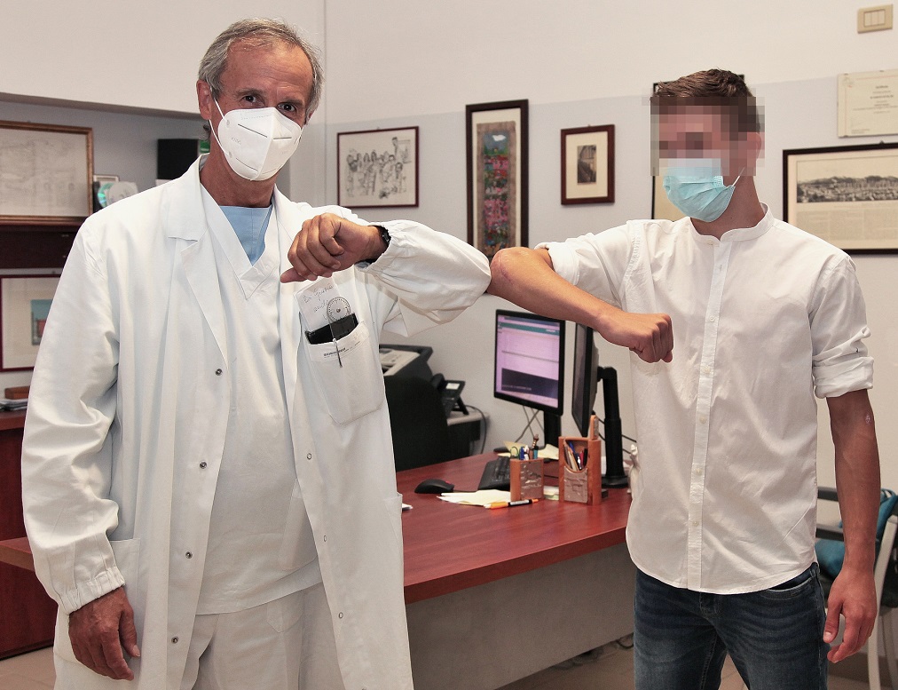 Dr. Roberto Rotini with the patient, after the surgery